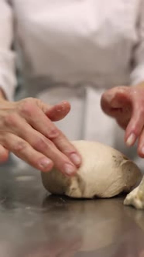 a chef makes bread in a bakery