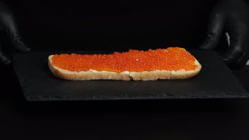 Close up of Red Caviar Sandwich Preparation
