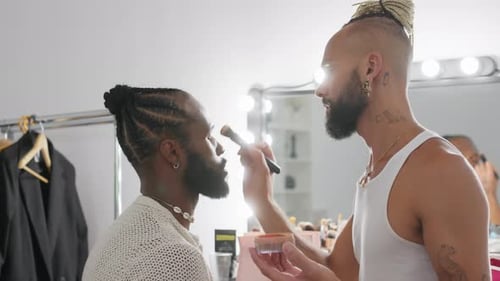 Makeup Artist Applying Makeup to Model in Studio