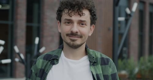 Young Man Smiling Portrait in Urban Environment