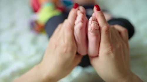 Newborn baby fingers. Close up view of baby feet.