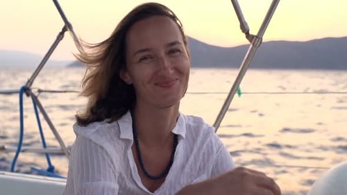 Happy Woman Enjoying Sailing Boat on Sea During Sunset 30s