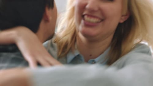 Joyful Woman Embraces Partner After Engagement Proposal