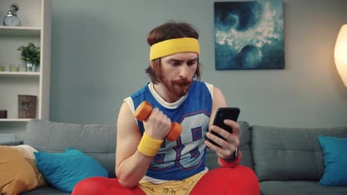 textFitness Enthusiast with Smartphone at Homekeywordsactivefitnesshealth