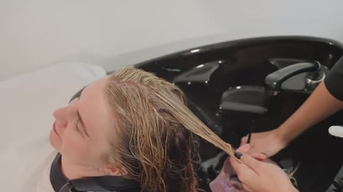 Woman getting her hair dyed at the salon