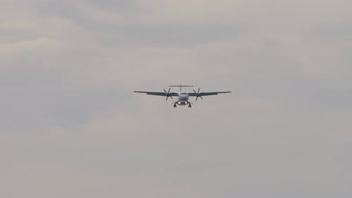 Turboprop Airplane Approaches in Cloudy Sky