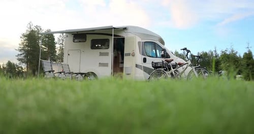 Camper with Bicycles Parked in Natural Setting