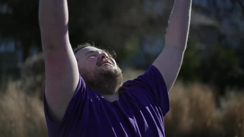 Man Outdoors Doing Yoga in the Sunlight