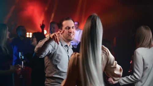 Young Adults Dancing Together at Nightclub Party