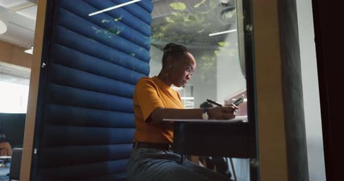 Woman, tablet and writing in office pod for article notes, editor feedback and story research