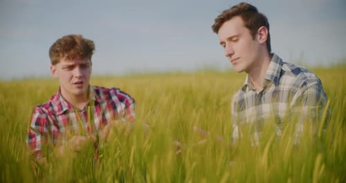 Two Male Farmers Discussing In Field Agriculture Crops Business Talking