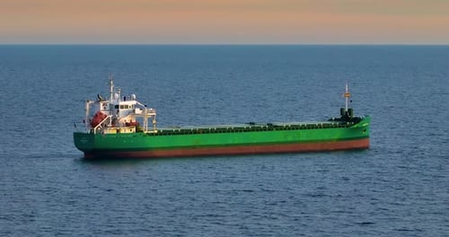 Aerial View of Bulk Cargo Carrier Sea Ship Anchored in Sea Waiting Entering Port