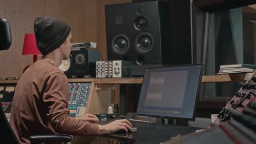 Producer Creating Music at Recording Studio