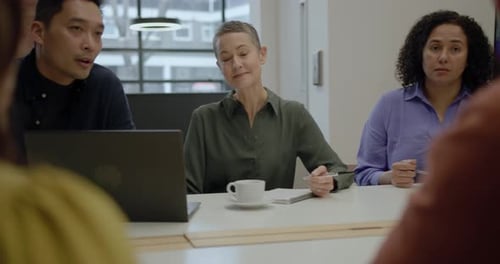 Business People Meeting and Discussing in Office