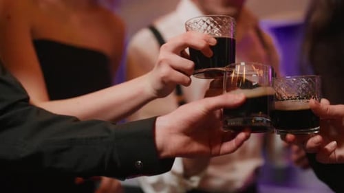 Young People Clinking Glasses on Party Close Up Hands of Young Men Toasting and Drinking Alcohol