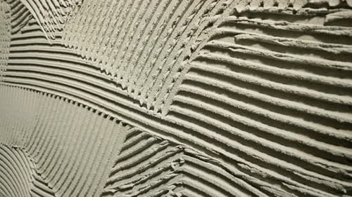 Déplacement de la caméra à l'aide d'une texture en béton frais avec motifs de truelle dentée