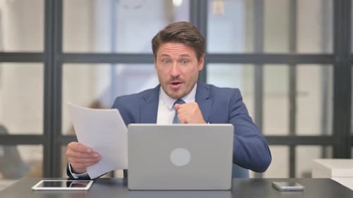 Man Receives Good News in the Office