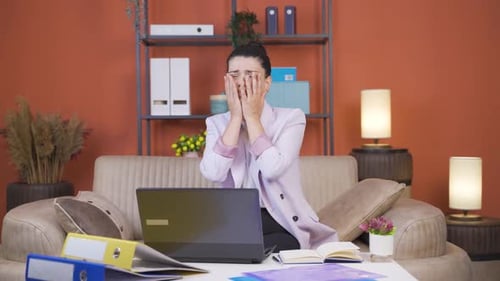 Home office worker young woman see her failure on laptop.