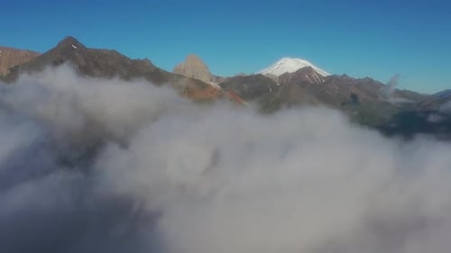 Aerial view of clouds and mountains at sunrise