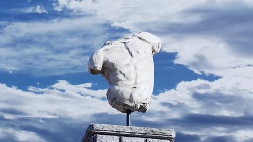 Classical Marble Torso Sculpture Against Dynamic Sky