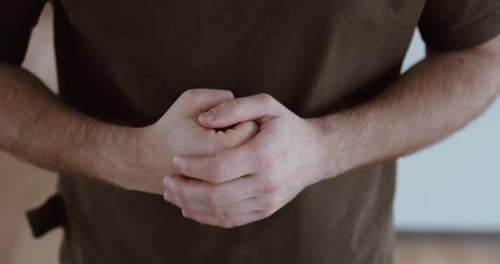 Hands Clenched Together – Violence and Tension Concept