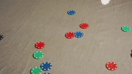 Poker Chips Falling on Table in Slow Motion