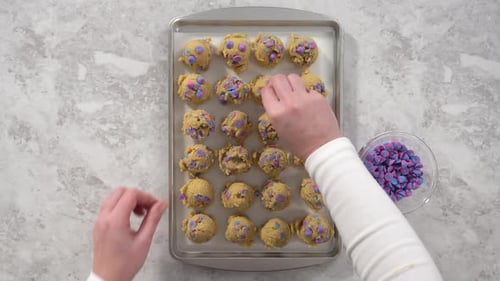 Flat Lay Scooping Cookie Dough with a Dough Scoop to Bake Unicorn Chocolate Chip Cookies