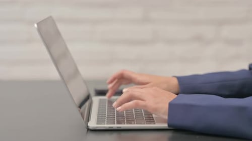 Close up of Woman Typing on Laptop