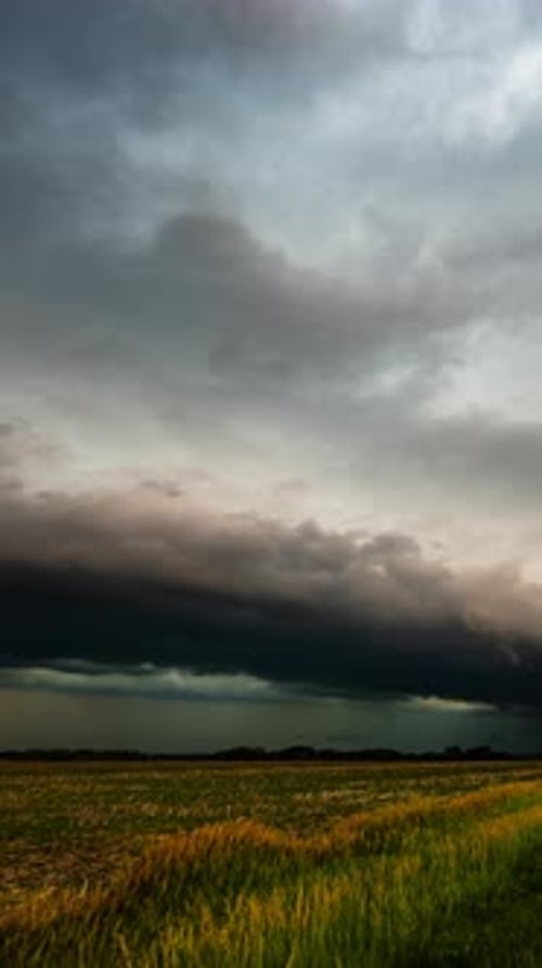 Dramatic Storm Clouds Over Golden Wheat Field