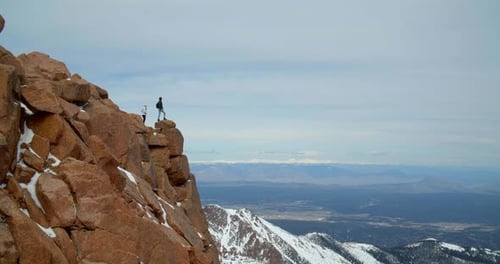 Hikers on Top of Rocky Mountains, Wide Landscape View From Peak Adventure