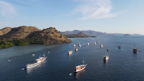 Aerial view of the beauty of Labuan Bajo is filled with a collection of traditional boats Pinisi.