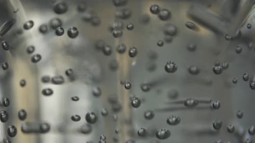 Macro Shot Of Bubbles Inside A Hand Sanitizer Bottle, Hygiene Against Coronavirus Pandemic