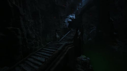 Dark Mysterious Staircase Leading Into a Cave with Faint Light Above