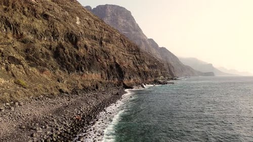 Idyllic scene of two people at unspoiled virgin beach in Gran Canaria, Spain during summer time