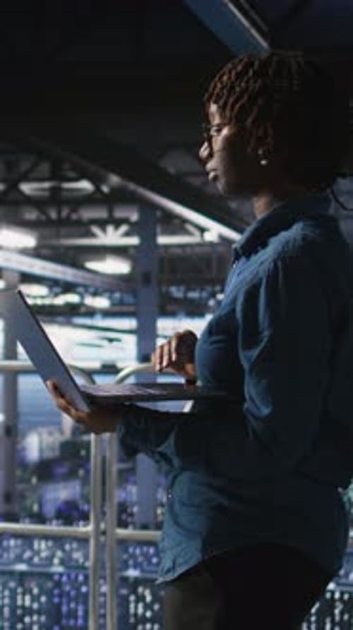 Vertical Video Data Center Teamworking Colleagues Running Diagnostics on Equipment