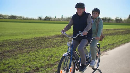 Senior Couple on Tandem Bike Ride in Countryside