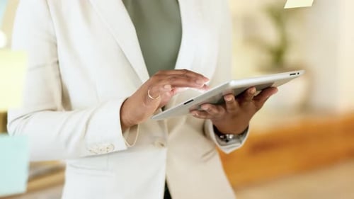 Woman Using Tablet in Modern Office