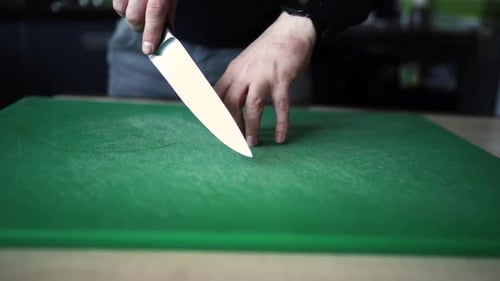 Man sharpens a knife. sharpening a chef's knife