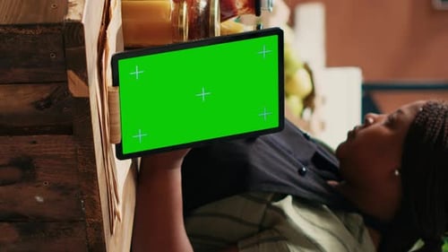 Vertical Video Device Showing Greenscreen Template at Local Supermarket