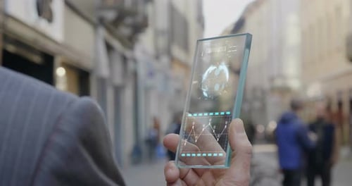 Man Interacts With Futuristic Glass Device