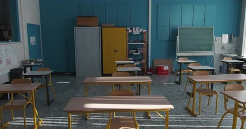 View of the back of an empty classroom. Backside of a school room. Class without pupils, with indivi