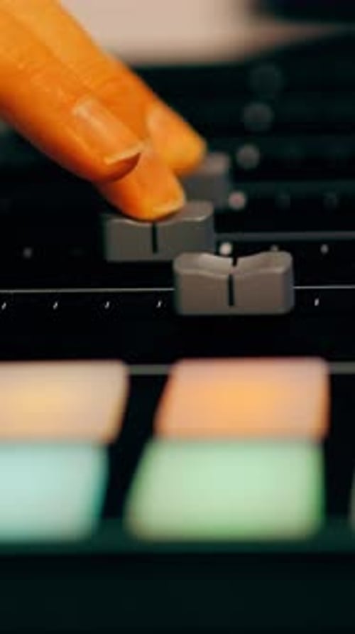 Audio Mixer Fader Adjustment Close Up in Recording Studio