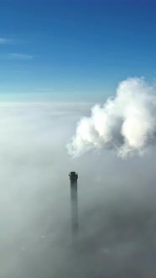 Aerial vertical view, chimney emissions, white smoke polluting skyline smog city