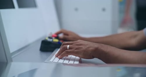 Close Up of Security Officer Controlling Luggage or Passenger Scanning Using Modern Equipment