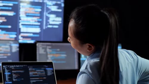 Close Up Back View Of Asian Female Programmer Having A Backache While Writing Code By A Laptop