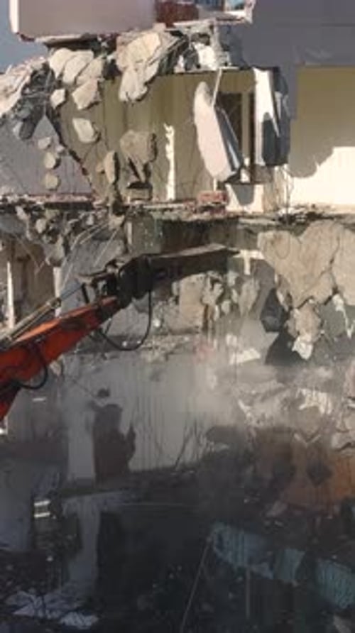 Building Demolition with Construction Machine Arm