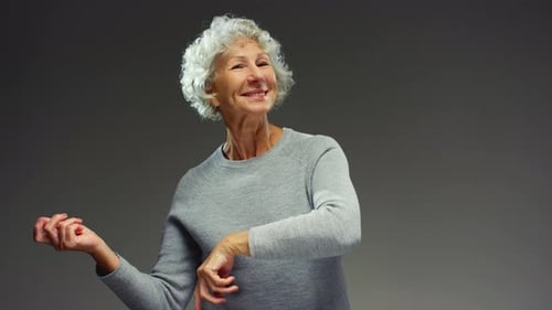 Happy Senior Woman 5060 Years Old Dancing Energetic Joyful Retired Female with Grey Hair Enjoying