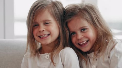 Smiling Sisters Together Indoors Close Up