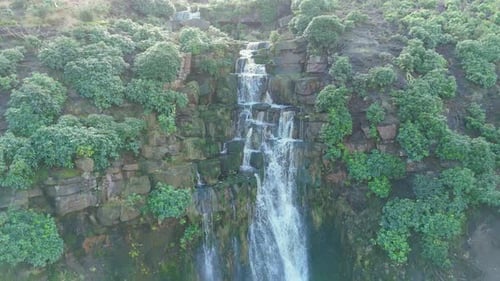 Aerial drone footage of a tall rocky waterfall in the Yorkshire Dales, Pennies. Moorland scene of a