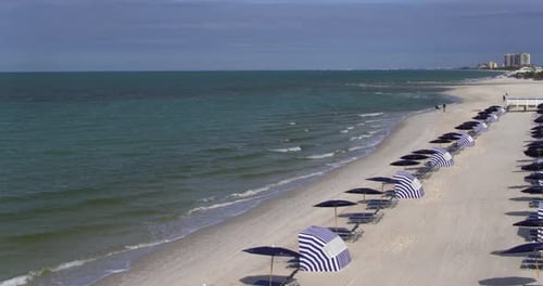 Beach Chairs and Tourists on Florida Beach, Aerial Drone Above